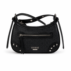 A black GUESS shoulder bag with an embossed monogram pattern, featuring a front zippered pocket, silver-tone studs, and a tassel zipper pull on a white background.