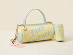Juicy Couture handbag with a light blue handle on a beige background