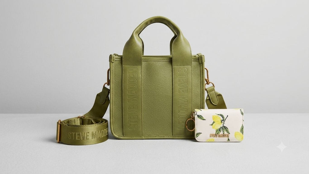 Green handbag with matching strap and small pouch on a light gray background