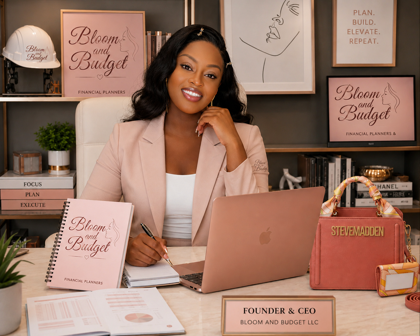 Woman sitting at a desk with a laptop and 'Bloom and Budget' materials, with a background of framed posters and books.