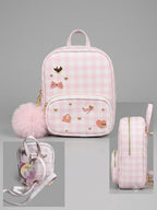 Pink checkered backpack with decorative elements on a gray background