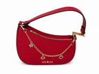A red GUESS crescent-shaped shoulder bag with gold-tone hardware, featuring a decorative chain with star and heart charms and the GUESS logo on the front, set against a plain white background.